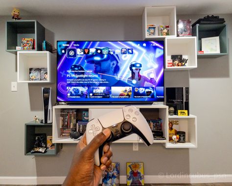 Image of a PlayStation 5 control and a tv with lots of shelves and other gaming games related content. Eket Tv Wall, Ps5 Floating Shelf, Wall Mounted Tv Ideas Video Games, Floating Shelf For Video Game Console, Floating Game Console Shelf, Playstation Mounted On Wall, Tv Shelf Ideas, Ikea Eket, Small Game Rooms