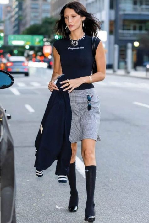 Look of the day for August 11, 2022 features Bella Hadid wearing knee-high socks with loafer pumps and a Michael Kors bag. Shop the look, here. #fashion #lookoftheday #style #womensfashion Pumps And Socks Outfit, Knee High Skirt Outfits, Knee Shorts Outfits, Knee High Socks Outfit Summer, Knee Skirt Outfits, Pumps With Socks, Skirt And Knee High Socks, Knee Socks Outfits, Knee High Skirt