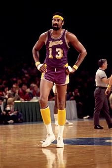 Wilt Chamberlain #13 of the Los Angeles Lakers walks the court during a game played against Milwaukee Bucks in 1972 at the Mecca in Milwaukee, Wisconsin. Wilt Chamberlain, Sporting Legends, Lakers Basketball, Nba Logo, Nba Legends, Sports Hero, Nba Stars, Basketball Legends, Milwaukee Wisconsin