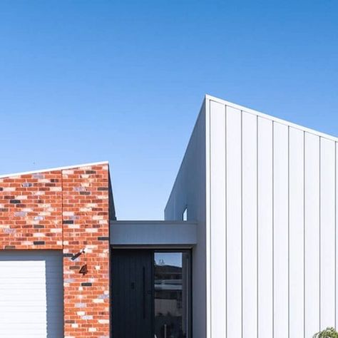 COLORBOND® steel on Instagram: "PERTOBE, a home designed and built by Victorian building design and interior design firm @designing_spaces, features COLORBOND® steel cladding in the colour Surfmist® Matt using the @LYSAGHT_au DOMINION profile. Architectural designers Nathan and Casey Divall of Designing Spaces, shared with us that “the LYSAGHT® DOMINION cladding was chosen as it provided the clean, vertical lines they wanted to accentuate the project’s raked ceilings, whilst the choice of COLORBOND® steel Surfmist® Matt as the colour for the cladding, allows the accompanying brickwork to pop in contrast”. This unique and stylish project also features landscaping by the homeowners, who love their stunning new home. 
 
Architect/Designers - Designing Spaces - Nathan and Casey Divall
Builder Vertical Cladding, Home Architect, Steel Cladding, Yard House, Victorian Buildings, Vertical Lines, Interior Design Firm, Brickwork, Interior Design Firms