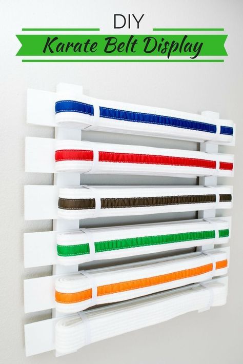 It may take years to earn all the belts, but it will only take you minutes to make this DIY karate belt display! Karate Belt Holder, Brother Bedroom, Taekwondo Belt Display, Karate Belts, Belt Display Rack, Taekwondo Belt, Karate Belt Display, Martial Arts Belt Display, Taekwondo Belts