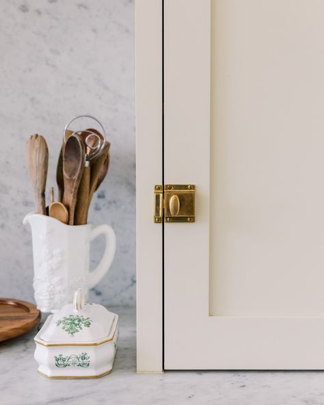 Inset storage cabinet with brass lock. Love the details. Locking Cabinet Hardware, Brass Latch Kitchen Hardware, Latch Hardware Cabinets, Cabinet Latch Hardware, Cabinet Latches, Marble Counters, Latches Hardware, Inset Cabinets, Decorating House