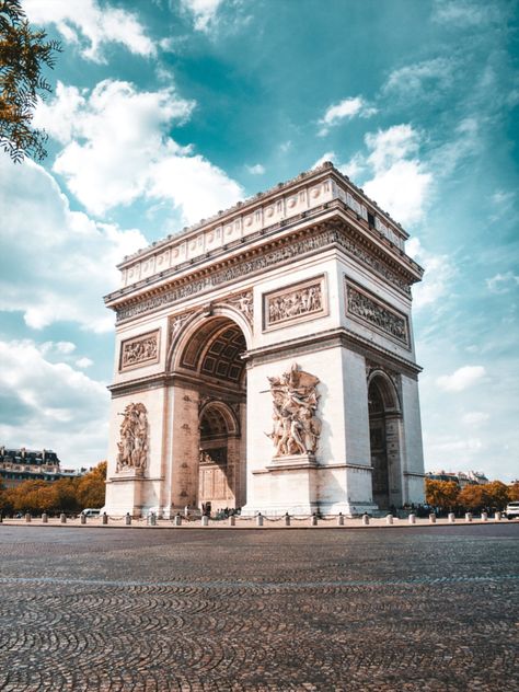 Tall stone archway of the Arc de Triomphe in the middle of empty cobblestone roundabout at the end of the Champs Elysées in Paris. Champs Elysees Paris, Paris Sightseeing, Champs Élysées, Observation Deck, Streets Of Paris, Palace Of Versailles, French Culture, Louvre Paris, Louvre Museum