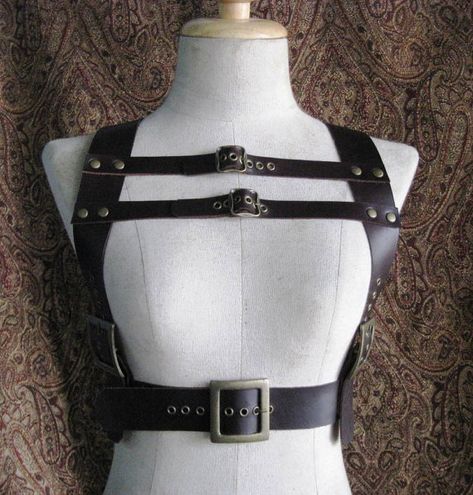 This is a great piece to finish off an outfit. 5 functional buckles 2 adjustable shoulder straps 2 small adjustable bust straps 1 adjustable waist buckle  available in black, brown, white, green, purple, and red  metal hardware can be silver or antique brass  sizes available are Harness Design, Harness Outfit, Harness Fashion, Antique Green, Leather Workshop, Leather Harness, Antique Metal, Fashion Design Clothes, Girls Fashion Clothes