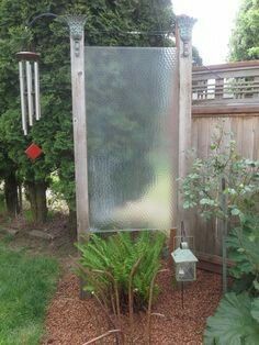 Repurposed Shower door Backyard Diys, Lawn Ideas, Garden Screen, Repurposing Ideas, Pathway Landscaping, Shower Glass, Garden Shower, Garden Screening, Outdoor Privacy