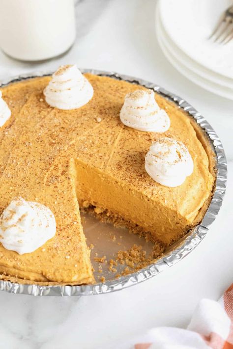 No-Bake Pumpkin Cream Pie has a light, creamy pumpkin filling in a pre-made graham cracker crust for an easy, breezy holiday dessert. Pumpkin Crème Pie, No Bake Pumpkin Pie With Graham Cracker Crust, Pumpkin Cream Pie No Bake, Pumpkin Cloud Pie, Pumpkin Creme Pie, No Bake Pumpkin Desserts, Whipped Pumpkin Pie, Pumpkin Pudding Pie, Easy No Bake Pumpkin Pie