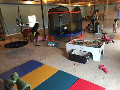 8 Must-Have Items For Your Child's Home Sensory Gym Garage Room Conversion, Sensory Gym, Gym Shed, Faux Wood Flooring, Sensory Equipment, Peanut Ball, Giant Stuffed Animals, Diy Sensory, Gym At Home