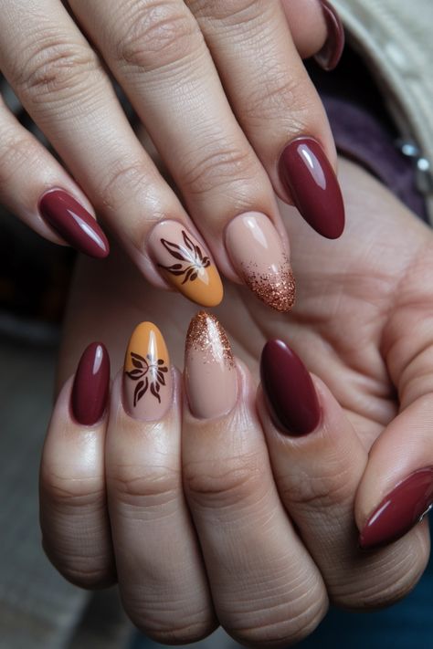 Embrace the essence of autumn with these cozy fall nail ideas that blend rich, warm hues and intricate designs. Picture deep burgundy and mustard yellow shades adorned with delicate leaf patterns that mirror the beauty of falling leaves. These stunning nails will elevate your style and capture the spirit of the season, perfect for cozy gatherings or festive celebrations. Get ready to turn heads this autumn! Fall Leaves Manicure, Fall Leaf Nails Autumn Leaves, Pastel Nail Art, Fall Nail Ideas, Stunning Nails, Nail Color Trends, Festive Nail Art, Dip Nails, Leaf Patterns