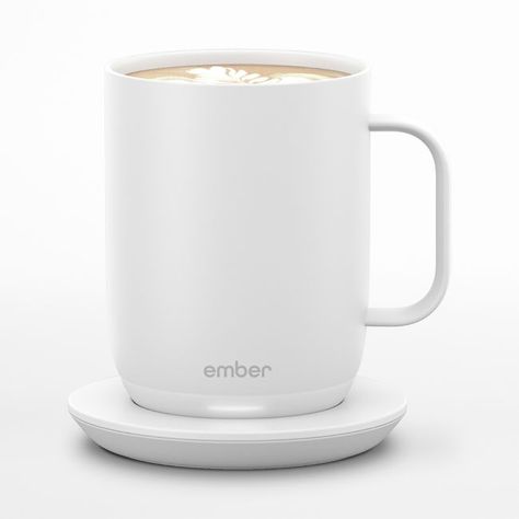 Keep your latte, chai, coffee or tisane at exactly the right temperature down to the last sip with this ingenious mug. Sleek and modern in bright white, the Ember mug maintains your desired temperature for over an hour thanks to a built-in battery. Or use the matching charging coaster to keep your drink perfectly hot all day long. Designed with a slim, elegant handle, the mug makes a thoughtful gift for someone who's constantly warming up or topping off their coffee.   • Stainless steel and plas Ember Mug Coffee, Ember Mug, Chai Coffee, Coffee Warmer, Xmas Wishes, Post Grad, White Heat, Warming Up, Coffee Accessories