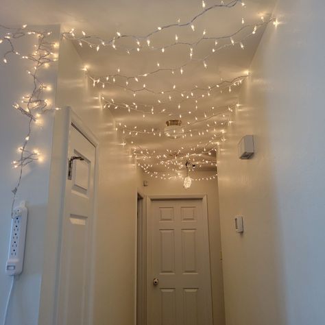 Hallway with Christmas Lights hung on the ceiling DIY Christmas decorations Fairy Lights In Hallway, Merry Christmas Home Decor, Hallway Fairy Lights, Hanging Christmas Lights On The Wall, Led Light Strip Ideas, White Christmas Fairy Lights, Hallway Christmas Decor, Christmas Fairy Lights Stairs, Christmas Light Cieling