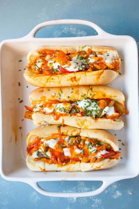 Baked Buffalo Chicken Subs: These have some of my favorite flavors and are easy to toss together either for dinner or for a hearty game day appetizer. Spicy and cheesy! | Macheesmo.com Baked Buffalo Chicken Sandwich, Subs Sandwiches, Chicken Subs, Baked Buffalo Chicken, Buffalo Chicken Sandwiches, Street Cafe, Wrap Sandwiches, Yummy Yummy, Poultry Recipes