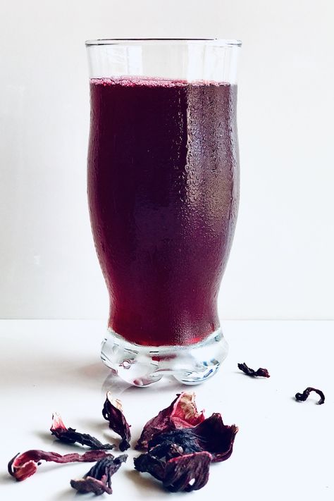 A refreshing drink made from dried hibiscus flowers and lightly spiced with cloves, ginger and selim. Sobolo tastes best when chilled. Hibiscus Coconut Drink, Hibiscus Strawberry Drink, Hibiscus Flower Drink, Hibiscus Drink Photography, Sobolo Drink Flyer, Zobo Drink, Spiced Hibiscus Cocktail, African Hibiscus Drink, Veg Salads