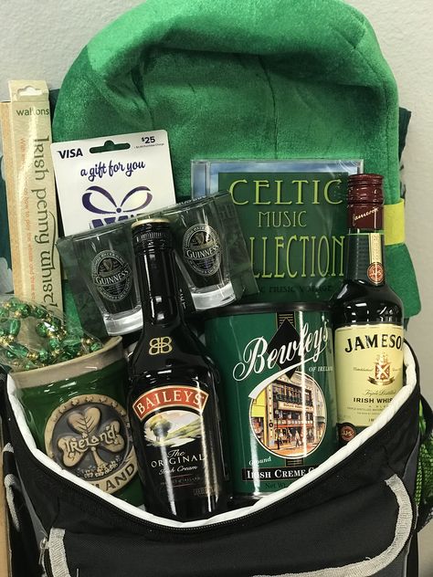 St. Patrick’s Day gift basket.  A touch of Irish! Bailey’s Irish Cream, Jameson Irish Whiskey, Bewley’s Gourmet Irish Creme coffee, Irish Penny Whistle, Celtic Music Collection CD, Guinness shot glasses, ceramic Shamrock coffee mug, shamrock patterned scarf, fun leprechaun hat and light-up emerald and gold beaded necklace. Irish Coffee Gift Basket, Irish Gift Basket Ideas, St Patricks Gift Basket, Jameson Gift Basket, St Pattys Day Gift Basket Ideas, St Patrick's Day Gift Baskets, St Patrick’s Day Raffle Baskets, Irish Gifts Ideas, St Patricks Day Basket Ideas