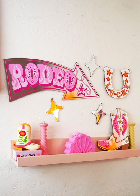 Get ready to add some western flair to your home with our Rodeo Arrow Mirror! Its bold, retro design in the shape of a rodeo sign arrow will bring a touch of circus style to any room. Perfect for those who don't take themselves too seriously. (Yee-haw!) Comes with COMMAND strips for hanging UV printed vinyl & acrylic mirror Size: 43cm x 20cm Disco Nursery, Vinyl Acrylic, Retro Mirror, Wavy Mirror, Big Mirror, Mirror House, Retro Wall Decor, Yee Haw, Command Strips