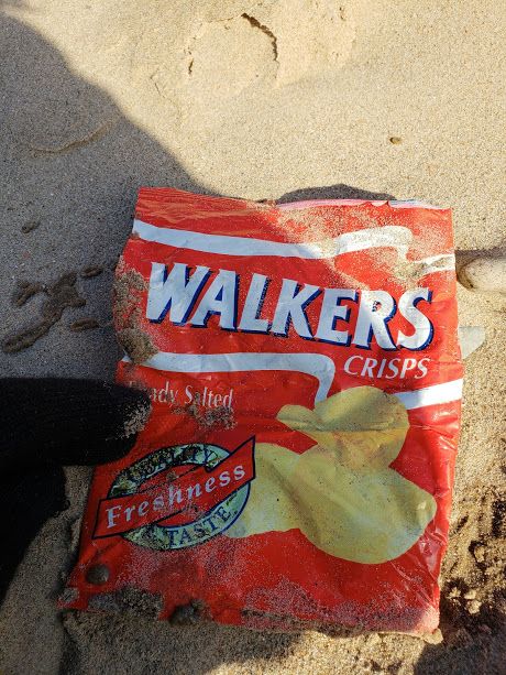 A 23 year-old crisp packet from 1995, found by a litter picker on Llanddwyn Beach on Anglesey, has highlighted the lasting effects that plastic waste has on our environment. Crisp Packet, Walkers Crisps, Cotton Eyed Joe, Sanitary Towels, Bin Bag, Types Of Plastics, Cotton Buds, Sanitary Pads, Unusual Things