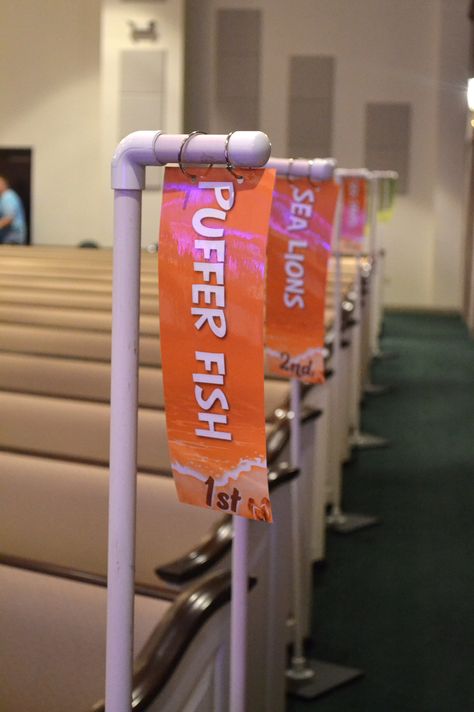 Easy sign holders for Ocean Commotion VBS teams in your assembly area #vbs2016 Vbs Signs Ideas, Breaker Rock Beach Registration Table, Scuba Vbs Crew Signs, Vbs Offering Contest Ideas, Ocean Stage Design, Ocean Commotion Vbs Decorations, Cruise Ship Vbs, Ocean Vbs Crafts, Breaker Rock Beach Vbs Decorations