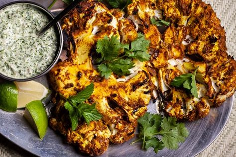 Marinating cauliflower in a yogurt-spiced paste adds an intense boost of flavor to this vegetarian main course. Easy Chile Relleno Recipe, Grilled Cauliflower Steaks, Zucchini Frittata Recipe, Easy Breakfast Dishes, Bbq Veggies, Munchies Recipes, Ham Salad Recipes, Cauliflower Steak, Grilled Cauliflower