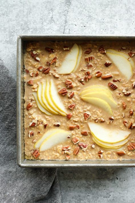 Whether you need the perfect breakfast for a holiday, special occasion brunch, or a make-ahead recipe to enjoy during the week, this Gingerbread Baked Oatmeal with Pears and Pecans is sure to please. It's studded with toasted pecans and sweet diced pear, and infused with a blend of warm gingerbread spices. Gingerbread Baked Oatmeal, Gingerbread Oatmeal, Easy Gingerbread, Baked Pears, Pecan Rolls, Toast In The Oven, Holiday Breakfast, Baked Oats, Unsweetened Applesauce