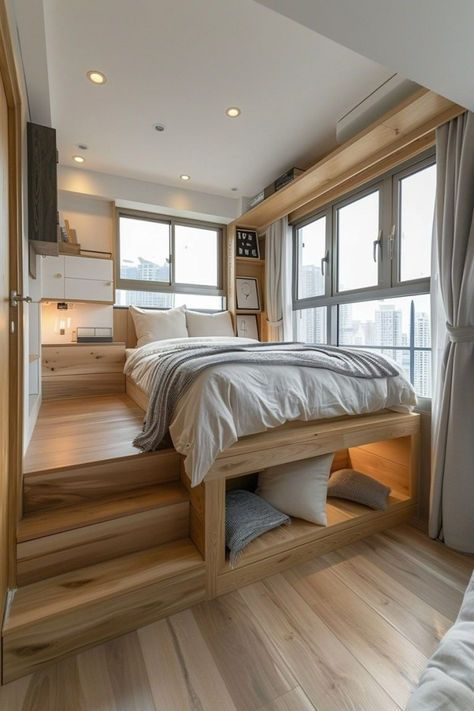 Elevated beds, including loft beds, are a fantastic space-saving solution in tiny bedroom apartment ideas. By raising the sleeping area above the ground, the space beneath can be used for storage, a desk, or even a seating area. This effectively doubles the usable space within the same footprint, making elevated beds ideal for very small bedrooms. They also add a playful, unique element to the room's design. Click or tap to see more elevated bed ideas for tiny spaces. Elevated Bedroom Design, Raised Bed Bedroom, Elevated Platform Bed, Tiny Bedroom Apartment, Raised Beds Bedroom, Home Interior Design Cozy, Raised Bedroom, Modern Home Trends, Bed On Floor