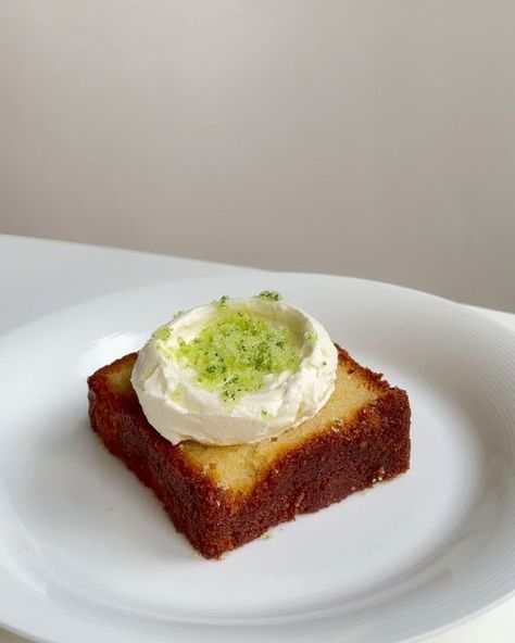 Kiki on Instagram: "Lemon loaf with whipped crème fraiche, basil sugar, and a drizzle of EVO 🍋🍃. For a not-too-sweet sweet treat that surprisingly worked well together.  I used the lemon pound cake recipe by @ayacaliva on YouTube. Topped with crème fraiche and cream whipped together, and granulated sugar and basil leaves pulsed in a food processor until blended 🍃 . . . . . . . . #cake #baking #bake #homebaking #lemon #oliveoil #sugar #sweet #bakingfromscratch" Basil Lemon Cake, Lemon Soaked Cake, Lemon Cake Doctored, Healthy Lemon Drizzle Cake, French Lemon Yogurt Cake, Lemon Pound Cake Recipe, Lemon Loaf, Lemon Pound Cake, Home Baking