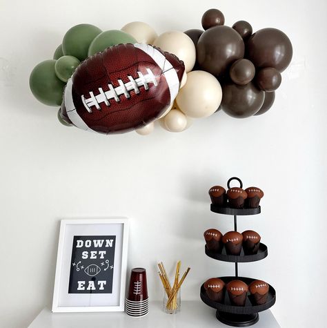 Perfect for a football party, this elaborate 3ft balloon garland collection includes everything you need to create this neutral balloon garland as well as three football balloons. Celebrate your quarterback with our Football Party Kit. You can purchase the entire collection or individual pieces.  YOU WILL RECEIVE (depending on what you order) 1 - Football Balloons 18 inches  Assortment of Eucalyptus Green Balloons Assortment of Cocoa Balloons Assortment of White Sand Balloons 3 ft Balloon Strip Balloon Glue Dots Balloon Garland Instructions IMPORTANT INFORMATION ASSEMBLY REQUIRED - Your balloons will arrive deflated and ready for blowing and assembly. SHIPPING - This kit will ship within 1 or 2 business days BALLOONS - 18 inch Foil / Mylar balloon is self sealing, fill with helium to float Football Party Activities, Football Balloon Arch, Football Balloon Garland, Cowboys Football Party, Football Birthday Decorations, Neutral Balloon Garland, Football Night, Balloon Inspiration, Football Balloons