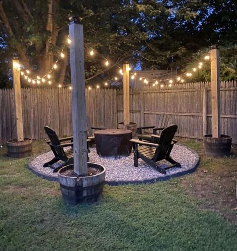 Fireplace lighting cozy backyard adirondack chairs fire pit fireplace baskets string lights Fire Pit Ideas Backyard Simple, Fire Pit Ideas Backyard On A Budget, Small Backyard Fire Pit Ideas, Fire Pit Lighting Ideas, Chairs For Garden, Barrel Fire Pit, Fireplace Baskets, Outdoor Fire Pit Area, Yard Deck