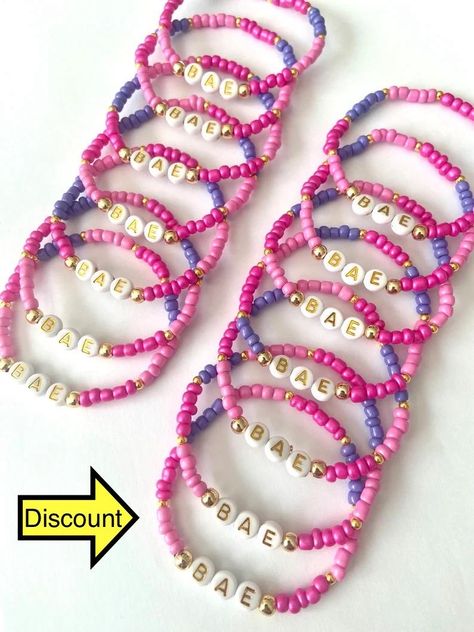 Gift letter design bracelet, optional name and text written on it, made in desired colors and desired size. Ready to ship in 10pcs - 200pcs 1-3 business days 200 pcs - 500 pcs 3-5 business days 500 pcs - 1000 pcs 1 week Bead letter color ? Beads color option ? Personalization ? Bracelet size ? Please specify in your order CARE TIPS: - Do not expose jewelry to water - Handle and store jewelry gently - Roll bracelets instead of stretching the band to wear Please These bracelets are 100% Handmade. Gift Letter, Store Jewelry, Design Bracelet, Letter Gifts, Gift Design, Color Beads, Letter Design, Summer Bracelets, School Gift