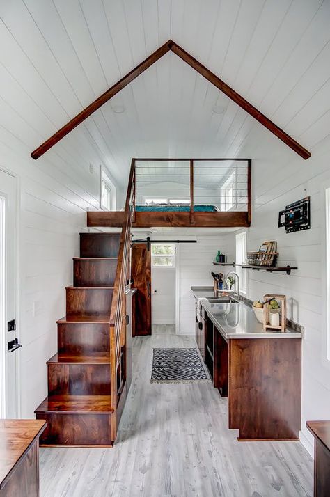 Inside the tiny home are poplar walls and vinyl flooring for easy maintenance. The stained wood finishes add vibrant color against the white walls and light gray flooring. Upcycled Kitchen, Tiny Home Living, Tiny House Interior Design, Tiny House Loft, Best Tiny House, House Loft, Tiny House Inspiration, Tiny Home Ideas, Modern Tiny House