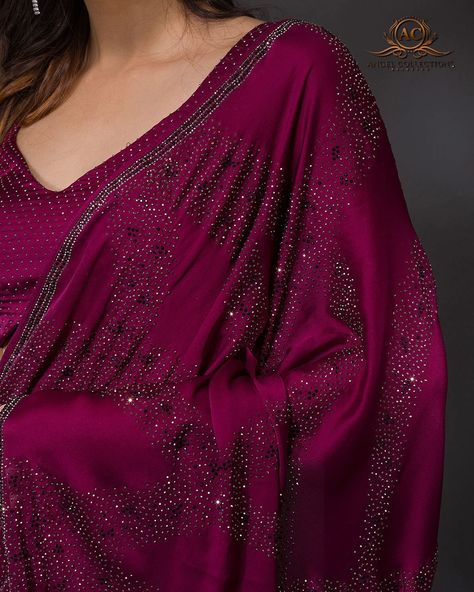 Wine Stonework Satin Designer Saree... Product Details Dance the night away in this glittering Stonework Red Saree. The Swarovski stones fused onto the flowy satin fabric will ensure the festival lights are on year-round. This Saree is ideal to wear for the bride-to-be for her cocktail party or reception night. It comes with an unstitched satin wine blouse, but you can also pair it with a black crop top for a trendy look. Size & Fit Saree: 5.5 Mtrs; Blouse: 0.80 Mtrs Rs. 7,490 Inclusive of A... Wine Red Saree, Wine Blouse, Red Saree, Swarovski Stones, Black Crop Top, Festival Lights, Designer Saree, The Festival, Black Crop