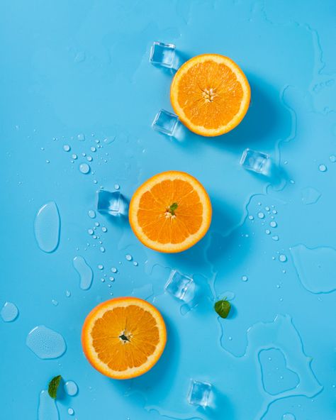 Three orange halves sit on a blue background - complementary colors Complementary Colors Examples, Aesthetic Orange, Wallpaper Estetika, Wallpaper Homescreen, Fruit Wallpaper, Fruit Photography, Orange Aesthetic, Orange Wallpaper, Orange Fruit