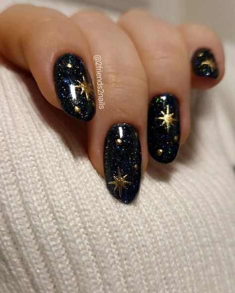 With sparkles, gold, silver, or fun holiday designs, New Year’s Eve nails can help you feel extra fabulous as you welcome a new beginning. Here are 50 nail ideas to inspire your next holiday manicure. Night Sky Themed Nails, Dark Colored Nail Designs, Navy Celestial Nails, Stars Moon Nails, Dark Celestial Nails, Moon And Stars Nail Designs, Nail Designs Celestial, Short Celestial Nails, Midnights Era Nails