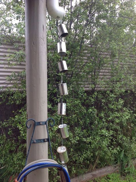 My rain chain made out of recycled tin cans, works well .... Rain Chain Diy, Rain Chimes, Recycled Tin Cans, Aluminum Can Crafts, Backyard Beekeeping, Rock Garden Design, Recycled Tin, Tin Can Crafts, Rain Chain