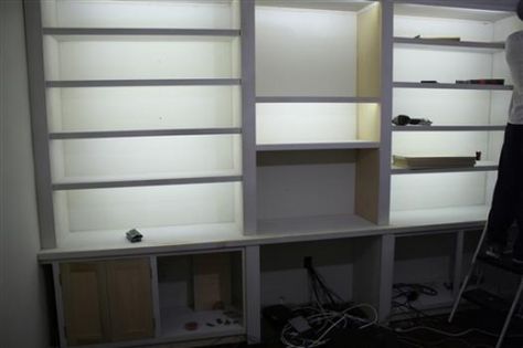 Bookshelves lit with LED reel/strip lights Cheap Shelves, Unique Bookcase, Bookshelf Lighting, Bookcase Lighting, Led Lighting Diy, Ikea Bookshelves, Ikea Shelves, Shelf Lighting, Ikea Home