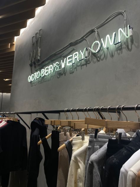 clothing garment rack at the ovo store by drake with a neon sign that reads October’s very own at the grove mall in Los Angeles The Grove, Drake, Angeles, Angel, Quick Saves, Los Angeles