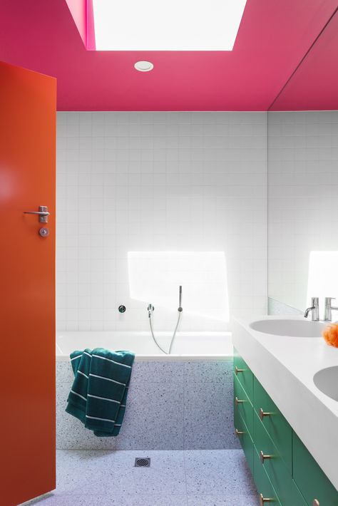 Colorful Minimalist Bathroom, Colorful Bathrooms, Pink Ceiling, Skylight Design, Colorful Bathroom, Green Vanity, Orange Door, Bathroom Decor Colors, Orange Bathrooms