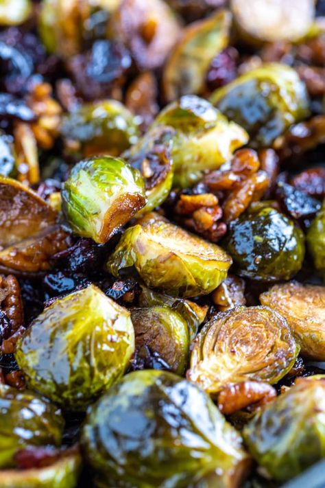 Roasted Balsamic Brussel Sprouts are the perfect holiday side dish made with balsamic vinegar, honey, chopped pecans, and dried cranberries. They're sweet, savory, and ready in under 45 minutes! #thanksgiving #sidedish #glutenfree #easyrecipe #dishingdelish Roasted Balsamic Brussel Sprouts, Honey Roasted Brussel Sprouts, Honey Balsamic Brussel Sprouts, Brussel Sprouts Cranberries, Balsamic Glaze Brussel Sprouts, Freezing Brussel Sprouts, Thanksgiving Sidedish, Baked Brussel Sprouts, Balsamic Brussel Sprouts