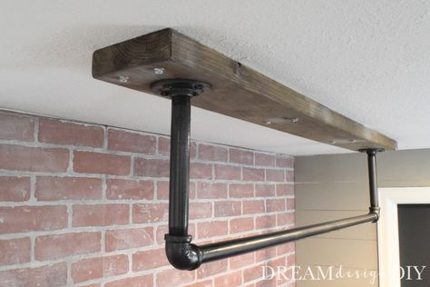 A ceiling mounted pull up bar is a perfect addition to a home gym. Here is a detailed tutorial to make your own. #pullupbar #ceilingmountedpullupbar #diypullupbar Garage Pull Up Bar, Diy Pull Up Bar, Diy Teepee Tent, Home Made Gym, Home Gym Basement, Home Gym Garage, Diy Home Gym, Basement Gym, Diy Gym