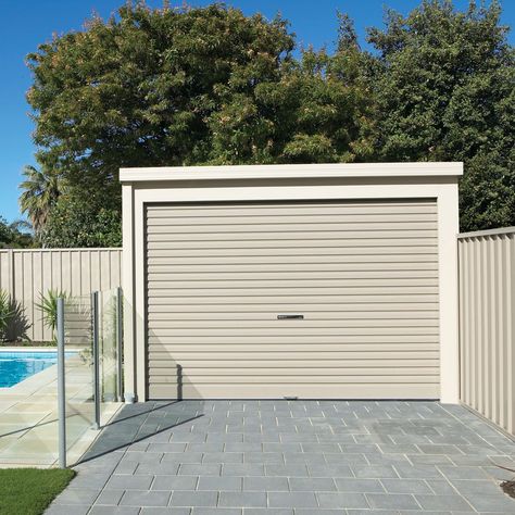 This Flat Roof Shed becomes the perfect garage with added roller doors. We can custom make a shed exactly to your liking! 😀 Want to add some windows? You got it! 👍 Come instore to create or head online for a quote of your dream shed (or garage) bit.ly/stratco-quote Pin this 📌 #stratco #australia #howto #garage #garagestorage #stratcogarage #storageideas #garagegoals #garageorganisation #shoplocal #homestorage #outdoorstorage #garageworkshop Carport With Roller Door, Flat Roof Shed, Car Shed, Simple Shed, Garage Organisation, Roller Doors, Studio Apartment Decorating, Diy Chandelier, Shed Design