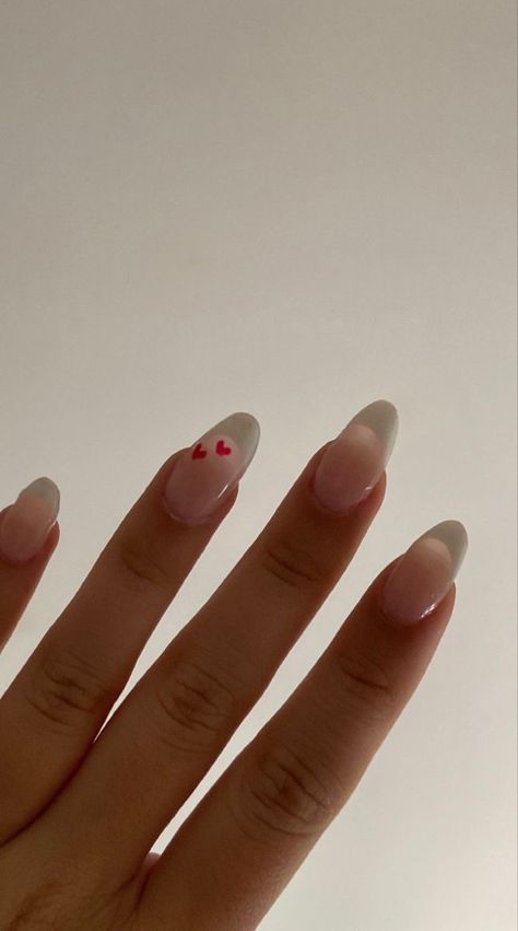 Oval French Tip Nails Valentines, Nails Inspiration French Tip Color, Heart French Nail, French Tips Love Heart, Nail French Tip With Heart, Valentine’s Day Oval Nails, Nails Heart Design Aesthetic, Valentines Nails Designs French Tips, French Almond Nails With Heart