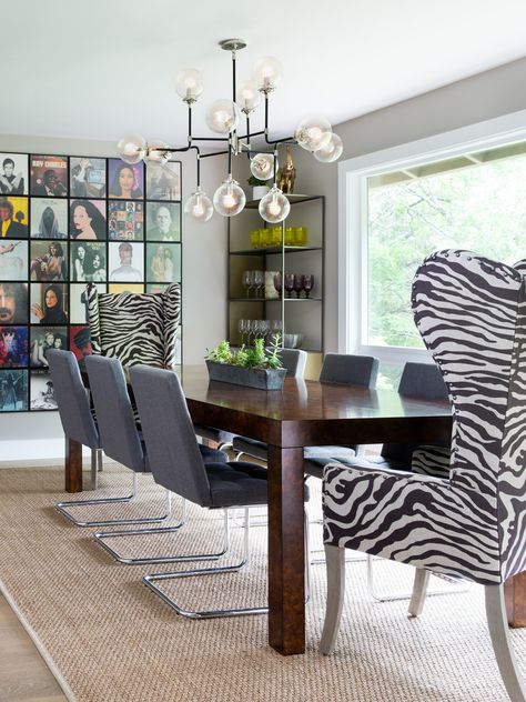 Get ready to dine in style with this bold twist on classic decor! 🦓🎶 Our client's dining room features sleek zebra chairs that bring a touch of wild sophistication, perfectly paired with eye-catching album cover art. 🖼️✨ Elevate your mealtimes and let your creativity shine with this unique combination. 
⁠
#DesignandConstruction #DiningRoomInspo #ZebraChairs #AlbumCoverArt #InteriorDesign Rock N Roll Living Room, Funky Dining Room, Rock And Roll Room, Fine Dining Room, Star Bedroom, Interior Design Consultation, Living Dining, Mid Century Modern Design, Room Themes