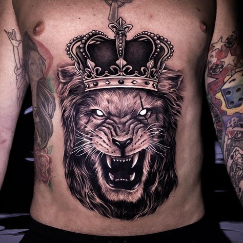 Lion Tattoo with Crown | Tattoo Ideas and Inspiration Crown Tattoo Ideas, Leo Lion Tattoos, Lion Tattoo On Finger, Roaring Lion Tattoo, Lion Back Tattoo, Lion Tattoo Meaning, Female Lion Tattoo, Lion With Crown, Small Lion Tattoo