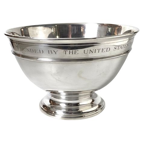 An impressive and heavy sterling silver punch bowl by Tiffany and Co, designed by William Thomas Lusk, 1950's The elegant styled large bowl is 13 inches in Diameter, 8.5 inches tall and weighs 82 oz. The bowl with the engraving "The J. Whitney Peterson Memorial Golf Trophy Founded by The United States Tabaco Company" The bowl with thick banded edges with a heavy round pedestal base. The markings on the underside with Tiffany and Co with the initial L for William Thomas Lusk Silver Punch Bowl, Golf Trophy, Golf Trophies, Initial L, Tiffany And Co, Large Bowl, Punch Bowl, Tiffany & Co., Serveware