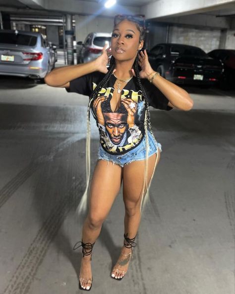 Clubwear outfit young dolph graphic tee jean shorts baddie outfit Party Outfits With Shorts, Black Graphic Tee Outfit Baddie, Brown Shorts Outfit Black Women, Graphic Tee Fits Black Women, Graphic Tee And Shorts Outfit Baddie, Party Outfit Black Women Shorts, How To Style A Graphic Tee Black Woman, How To Tie Graphic Tee, Graphic Tshirt Outfit Black Women