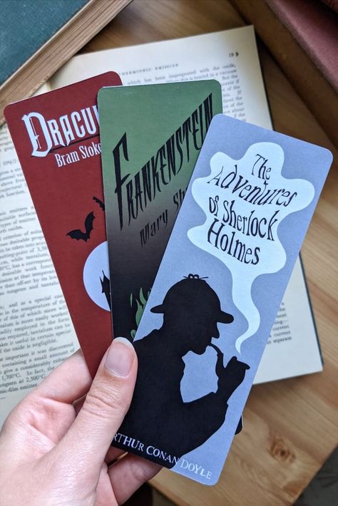 This set of three classic book bookmarks is the perfect gift for any book lover or bookworm! With three designs based off Dracula, Sherlock Holmes and Frankenstein, each bookmark has the beginning of the opening chapter printed on the reverse. All bookmarks are printed onto waterproof 300gsm paper and hand made by me in my little studio. Book Bookmarks, Book Bookmark, Cool Bookmarks, Library Inspiration, Creative Bookmarks, Paper Bookmarks, Gift Box Design, Classic Book, Diy Bookmarks