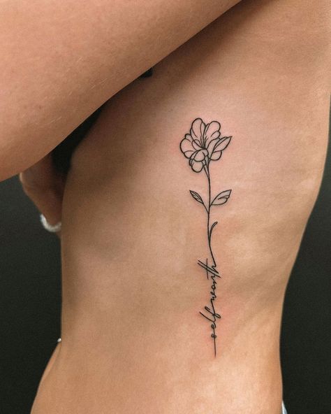 20 Beautiful and Meaningful Flower Tattoo Ideas for Women - Tikli Flower Tattoos On Ribs For Women, Side Floral Tattoos Women, Lotus Flower Tattoo Ribcage, Tattoo Ideas For Women Side Rib, Tattoo Designs For Women Thigh, Female Tattoos Side Ribs, Word Flower Tattoo, Flower On Side Tattoo, Love Yourself Flower Tattoo