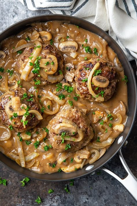 Hamburger Steak and Gravy – Seasoned tender hamburger patties smothered in gravy with mushrooms and onions is a quick, easy and comforting dinner! #hamburgersteak #gravy #dinner Turkey Burger Steak And Gravy, Hamburger With Mushrooms And Onions, Hamburger In Gravy, Hamburger Patty And Gravy Recipe, Hamburger Patties In Gravy, Hamburger Patties With Mushroom Gravy, Hamburger Patty Casserole, Smothered Hamburger Patties Gravy, Smothered Burgers With Gravy