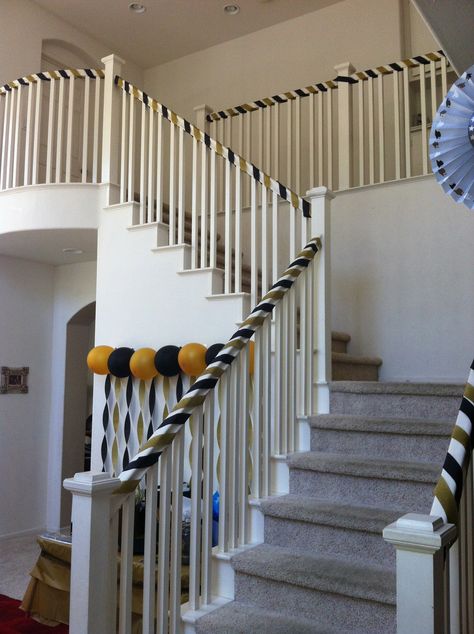 Streamers On Stairs, Gold Streamers, Greek Party Theme, Mocktail Bar, Streamer Decorations, Party Streamers, Stair Decor, Gold Theme, Black Backdrops