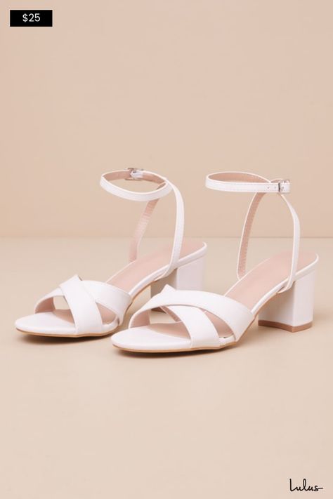 If you're wondering why everyone is staring, it's definitely because the Marcy White Ankle Strap High Heel Sandals are too cute not to! Smooth faux leather shapes these versatile heels that feature an almond-shaped toe bed and wide, crisscrossing toe straps. Slender straps sprout from the sides to wrap and secure around the ankle with a silver buckle. A classic block heel ensures that you'll stay comfortable and stylish all day long. 2. 5" wrapped block heel. Lightly cushioned insole. Rubber sol Homecoming Shoes, White Block Heels, Strap High Heels, Nail Bags, White Sandals Heels, Ankle Strap High Heels, Almond Shaped, Cute Heels, Sandal Heels