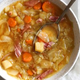 If you're making a big bone-in ham for the holidays this year, don’t throw away the leftover ham bone once all the meat’s been cut off. It’s a key ingredient in this soup that adds instant flavor with minimal effort! Here I added some vegetables, potatoes and cabbage, there are no beans but you can add some if you wish. So delicious and easy to make! Leftover Ham Bone Soup, Bone Recipes, Ham Bone Recipes, Autumn Soups, Leftover Ham Bone, Ham And Cabbage Soup, Ham And Cabbage, Soup With Potatoes, Ham Bone Soup