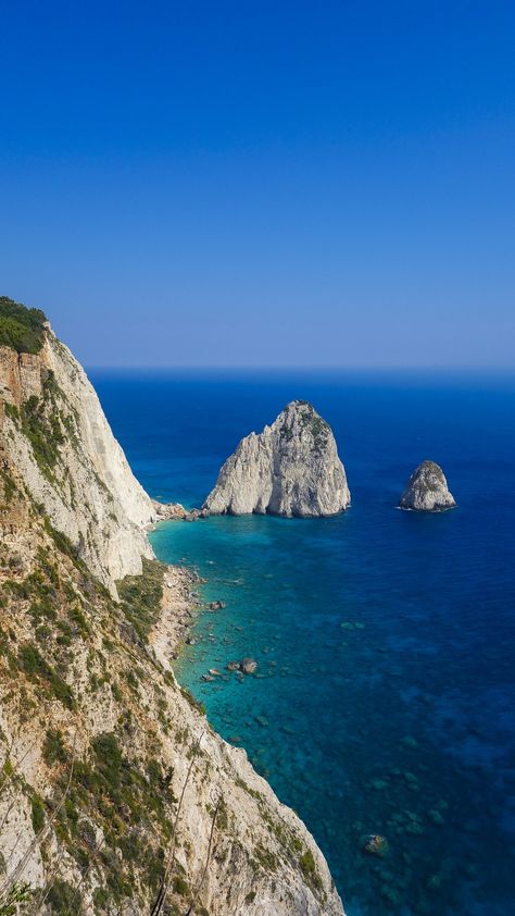 The Mizithra - two pyramid-shaped white rocks. They got their name from a local white feta cheese called Mizithra which is produced in Zakynthos. Individually the rocks are named Megali Mizithra ("large white cheese") and Mikri Mizithra ("small white cheese") Rhodes Island Greece, Greece Sea, Zakynthos Greece, Places In Greece, Rhodes Greece, Travel Inspiration Destinations, Nature Instagram, Travel Photography Inspiration, Island Getaway